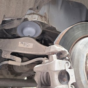 Brake rotor, caliper bracket and hub exposed during a brake job