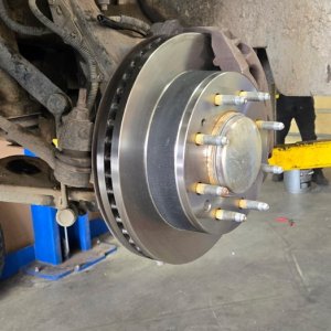 Brake rotor and hub assembly on a truck supported by jack stands