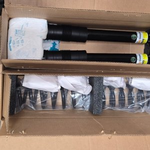 Boxed replacement shocks and struts with mounting hardware