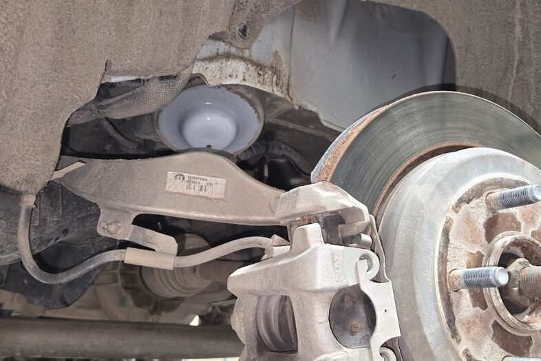 Brake rotor, caliper bracket and hub exposed during a brake job at Gary Johnston Truck and Auto Repair