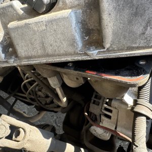 View of the transmission bellhousing from underneath the vehicle
