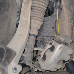 Front strut, coil spring and steering knuckle during suspension work