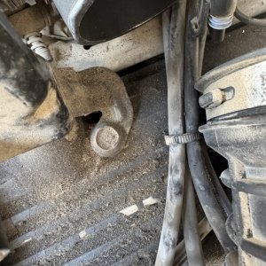 Underside view of the engine oil pan and surrounding lines